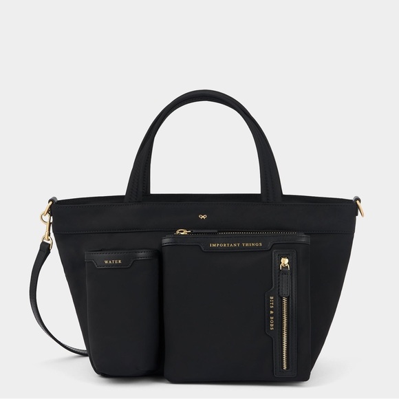 N/A Handbags - E/W Multi Pocket Mini Cross-body Tote
Regenerated ECONYL® in Black